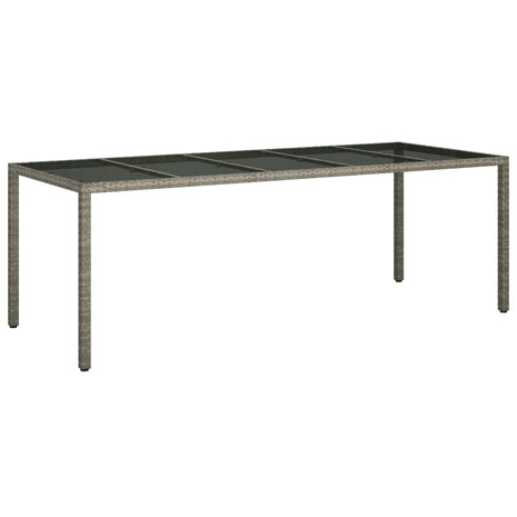 Tuintafel 250x100x75 cm gehard glas en poly rattan grijs